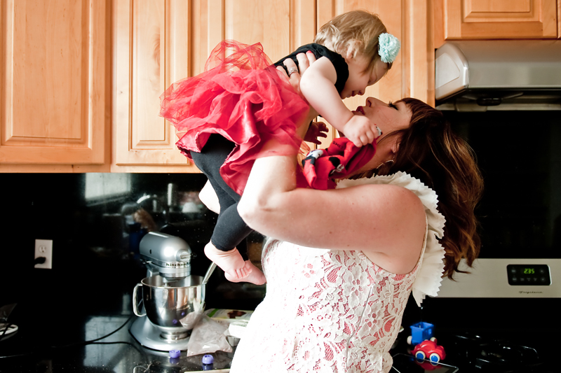 mom-holding-baby-up-kissing-kitchen-tutu