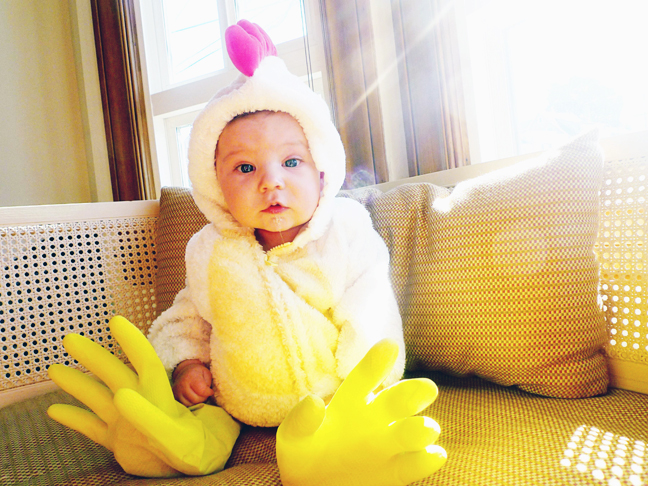 baby Halloween costume chicken with kitchen gloves