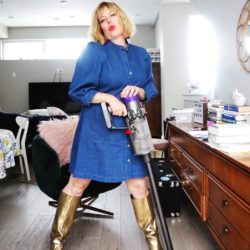 mom in gold boots with vacuum cleaner