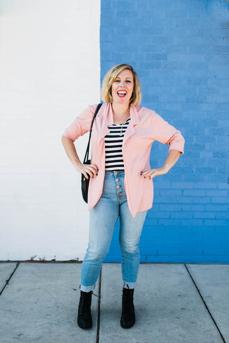 woman with striped shirt and jeans with blazer